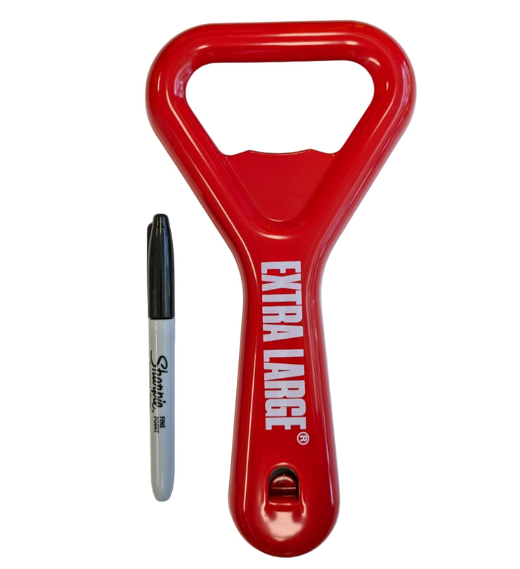 Red 'Extra Large' bottle opener on a white sheet of paper with a Sharpie pen for scale.