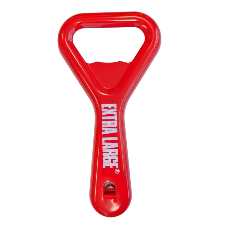 Red bottle opener with 'Extra Large' text on a white sheet of paper.